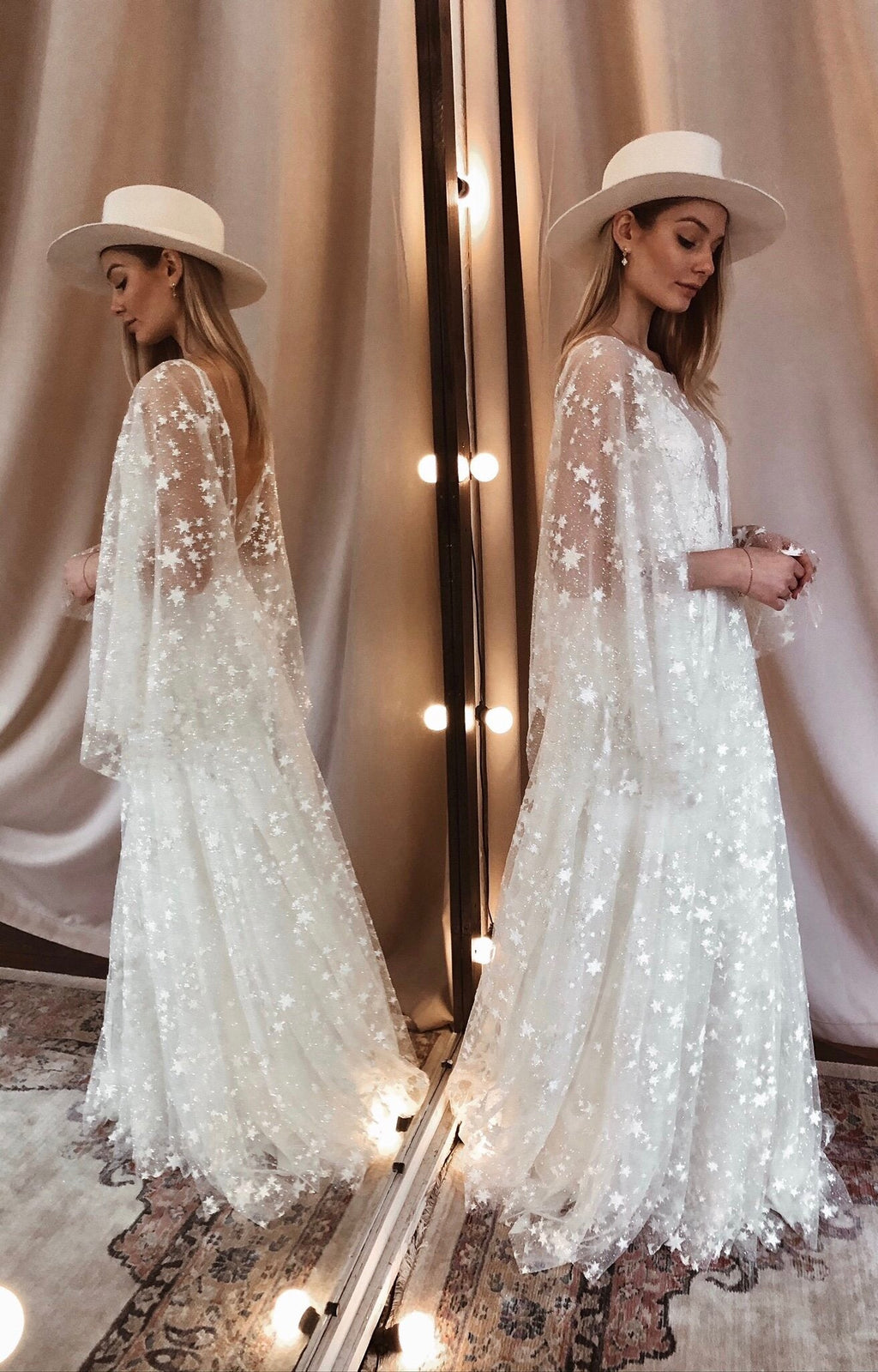 Bride in a white hat seen in a mirror, star lace wedding dress with an open back and long cape sleeves, Counting Stars