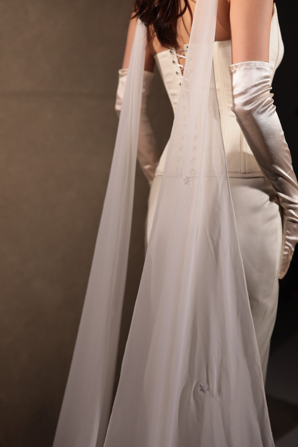 Back view of satin bridal separates showing the lace-up corset back, chiffon scarf and long gloves, Solana Ensemble