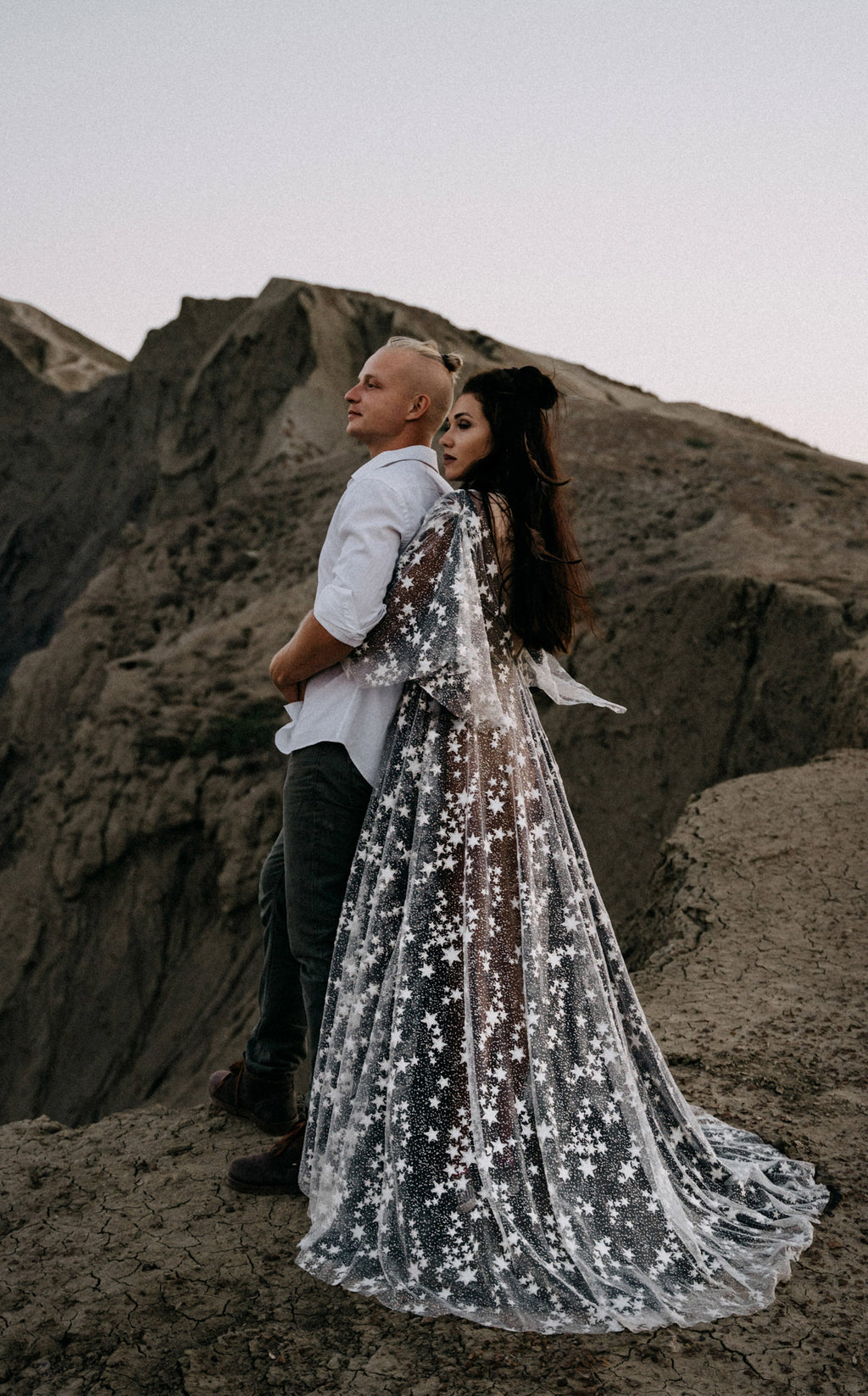 Elopement couple on a rocky ridge, bride in a black and ivory star lace wedding dress with a long train, ASH Counting Stars