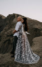 Elopement couple on a rocky ridge, bride in a black and ivory star lace wedding dress with a long train, ASH Counting Stars