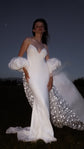 Bridal cape at night with a star-scattered inner train catching the flash, puff sleeves and ivory slip gown, Aura Cape
