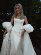 Smiling bride in an ivory bridal cape with chiffon puff sleeves and a star-scattered train, garden at dusk, Aura Cape