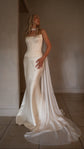 White chiffon bridal scarf knotted at the throat and trailing beside a satin corset gown with a long train, Celeste Scarf