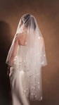 Back view of a star wedding veil in two tiers, stars scattered across sheer tulle over a corset back, Celestial Glow Veil