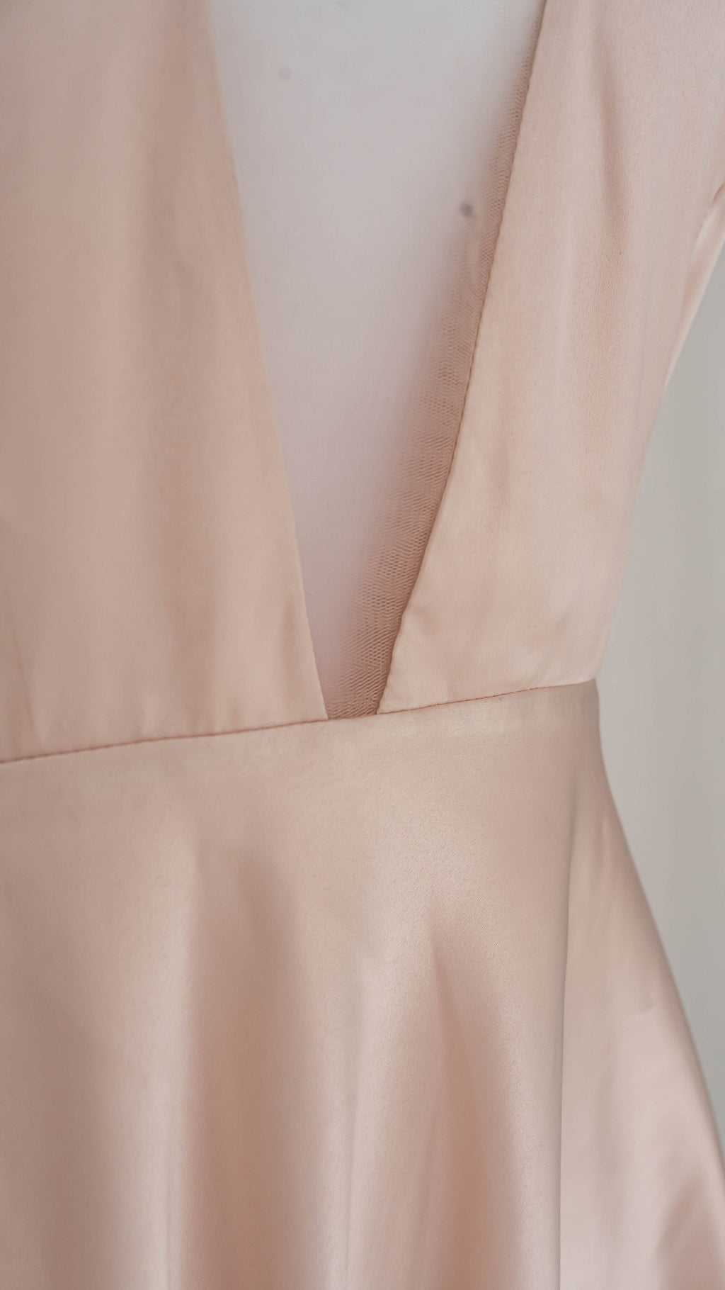 Detail of the deep V-neck blush satin lining under a short star lace wedding dress, dress form, Cosmic Dancer