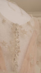 Back detail of a star lace mini wedding dress with a row of covered buttons and glitter tulle, Cosmic Dancer