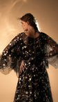 Back of a black star lace wedding dress with button closure and sheer cape sleeves, Counting Stars Black