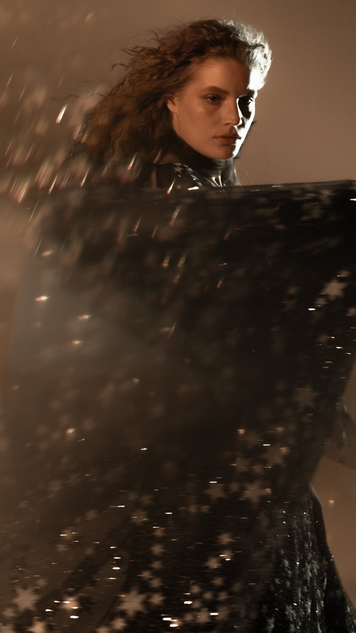 Black star lace sleeve sweeping in motion, glittering stars catching the light, Counting Stars Black wedding dress