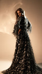 Back view of a black celestial wedding gown with star lace train and sheer cape sleeves, Counting Stars Black