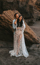 Couple embracing against a red rock, bride in a sheer star lace wedding dress with puff sleeves, Counting Stars Sample