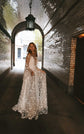 Full-length star lace wedding dress with long sleeves in a brick tunnel under a hanging lantern, Counting Stars