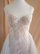 Dress form close-up of a corded lace sweetheart bodice with thin straps and tulle overskirt, Feathers Sample