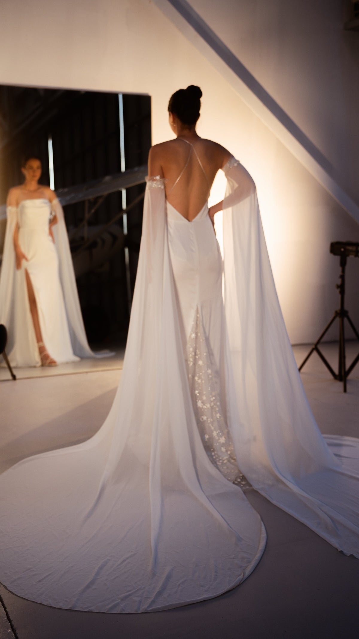 Studio back view and mirror reflection of a silk wedding dress with star lace train and chiffon sleeves, FEYRE