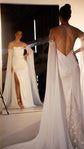 Bride by a mirror showing the cowl front and leg slit, back view with criss-cross straps and star lace panel, FEYRE