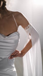 Detail of a draped silk bodice on spaghetti straps and a long detachable chiffon sleeve with a lace band, FEYRE