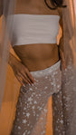 Close-up of the elastic waistband and glittering stars on sheer lace bridal pants, veil at the side, Galactic Outlaw