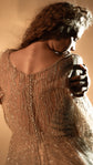 Back close-up of the sheer tulle back with a row of transparent buttons on a champagne lace wedding dress, Galaxy Champagne 2.0