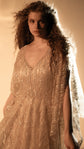 Waist-up crop of a V-neck champagne glitter lace wedding dress with open slit sleeves and a satin slip beneath, Galaxy Champagne 2.0