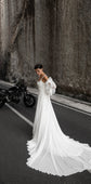 Bride looking down on an empty canyon road, square-neck chiffon wedding dress with a cathedral-length train and organza sleeves, LUNA
