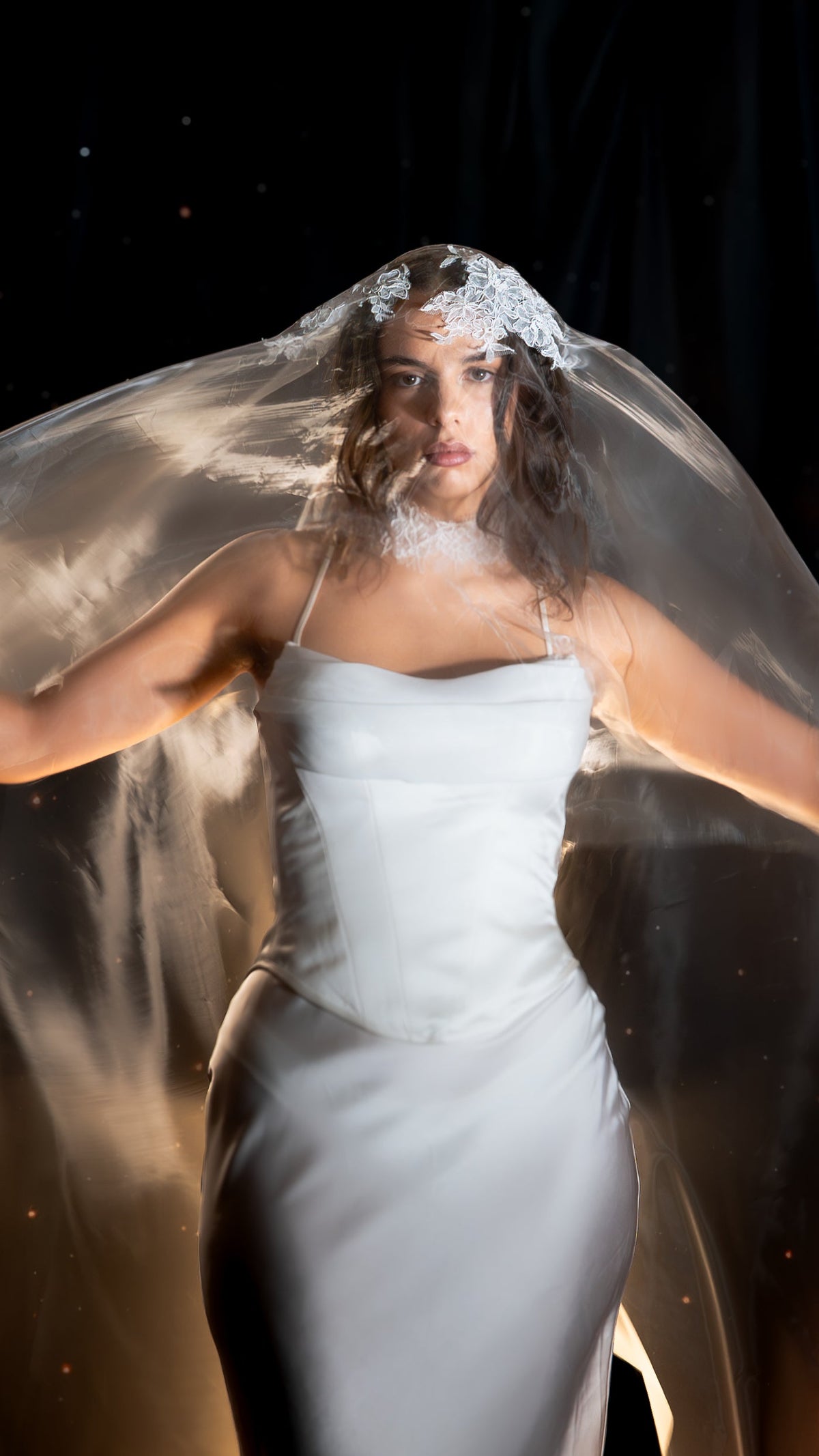 Lace bridal choker worn under a sheer veil with a lace trimmed edge, model in a strapless corset gown, arms out, Lyra Lace Choker
