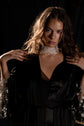Ivory lace bridal choker worn with a black satin robe with star lace sleeves, model holding the robe at her shoulders, Lyra Lace Choker