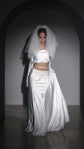 Shoulder-length two-tier wedding veil in soft white tulle with a blusher, worn with a satin crop top and skirt. Madonna Veil by Ephemeris