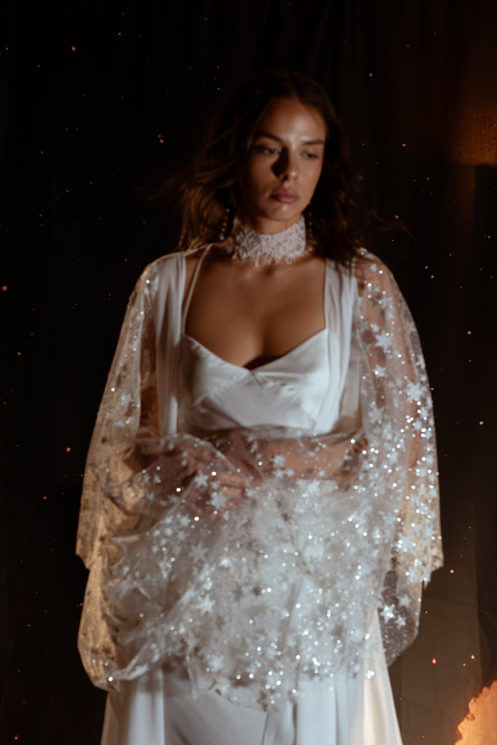 Close crop of sparkling star tulle sleeves gathered at the waist, satin bridal robe over a slip dress, lace choker, Metamorphosis Robe