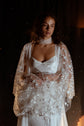 Close crop of sparkling star tulle sleeves gathered at the waist, satin bridal robe over a slip dress, lace choker, Metamorphosis Robe