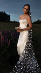Bride in a strapless satin corset gown with a black star wedding veil falling from the crown, lupines at dusk, Milky Way Veil Black