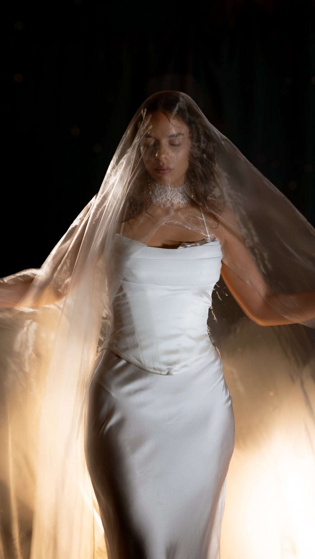 Super organza wedding veil swirling around a bride in a satin corset dress, ethereal motion, Moonglade