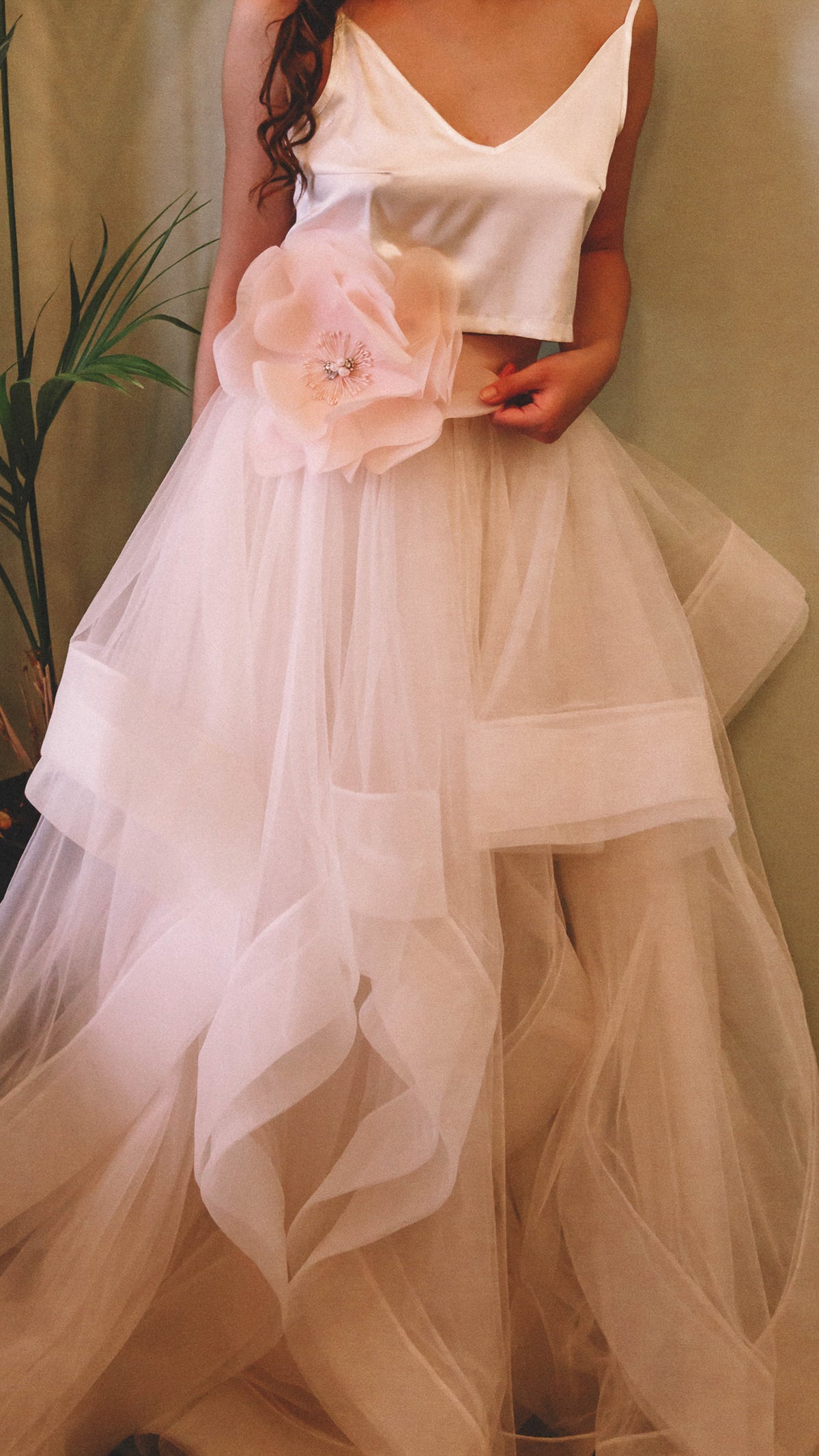 Blush two-piece wedding dress, satin V-neck crop top over a layered tulle skirt with horsehair trim and a fabric flower, Ready or Not Blush by Ephemeris