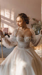 Bride on a rope swing in an off-shoulder tulle wedding dress, cotton flower corset and puff sleeves in sunlight, Savanna