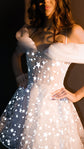 Close crop of a star lace mini wedding dress, stars bright under the flash, hand on hip, Shooting Star