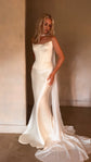 Bride in a strapless satin bridal corset and skirt with a pooling train and a long chiffon scarf, empty sunlit room, Solana Corset