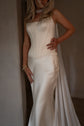 Strapless corset and skirt bridal separates in cream satin, bride with hand on hip and a chiffon scarf at her neck, Solana Ensemble