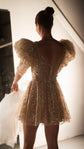 Back view of a champagne mini wedding dress showing the scoop back, button closure and puff sleeves, ceremony to reception, Soleil