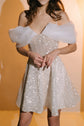 Close crop of a sparkle lace mini wedding dress with a structured bodice and pleated organza off-shoulder drapes, Starlight