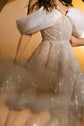 Motion crop of an off-shoulder sparkle lace wedding dress with pleated organza drapes and a swirling skirt, Starlight