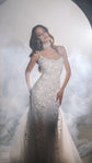 Model in a cowl-neck star wedding dress with spaghetti straps and a tulle train, haze rolling behind, ethereal, Supernova