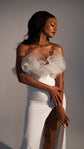 Crepe sample wedding dress with ruffled tulle framing the collarbone and a thigh-high slit, arms crossed, studio, Terra Sample