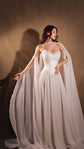 Bride reaching out in a strapless bridal corset with the Venus Skirt, chiffon sleeves fanned out on the floor, basque waist, Venus Corset