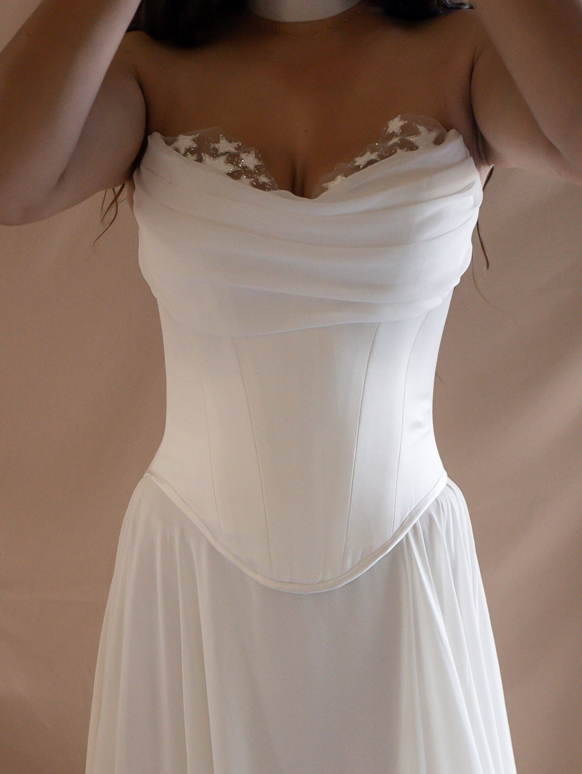 Front crop of a strapless corset and skirt, draped chiffon neckline with star lace and a basque waist seam, Venus Ensemble