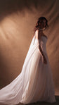 Chiffon bridal skirt with a long flowing train, worn with a strapless satin corset and sheer sleeves, side view, Venus Skirt by Ephemeris