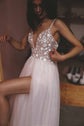 Close crop of a deep V corset bodice covered in star appliques on thin straps above a sheer skirt with a slit, Make a Wish
