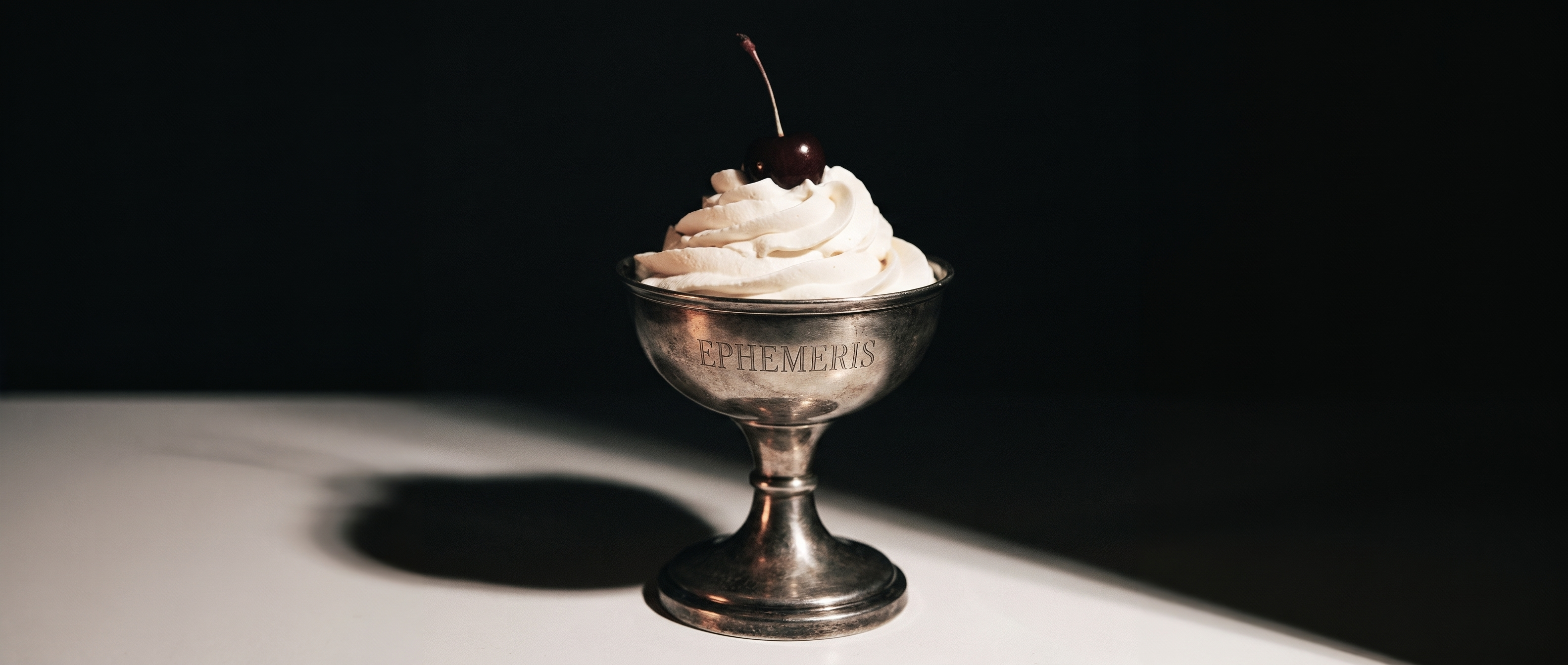 Ephemeris silver dessert cup with cream and cherry